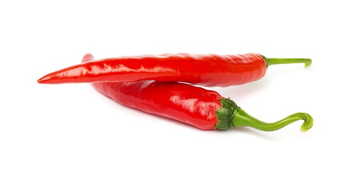 Two pods of hot pepper on a white background