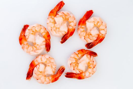 Ten cooked cocktail tiger shrimps are partnered with eachother to create ying yang design
