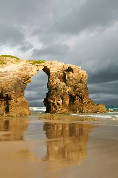 Las Catedrales beach, Ribadeo, Spain. Last ray of sun in the early morning before the rain.