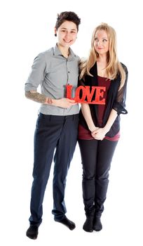 Cute Lesbian couple 30 years old shot in studio isolated on a white background
