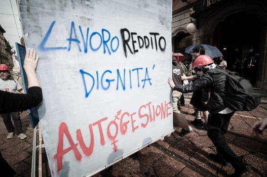 MILAN, ITALY - MAY 1: labor day held in Milan on May 1, 2013. Every year thousands of people taking to the streets to celebrate labor day and to protest against italian austerity