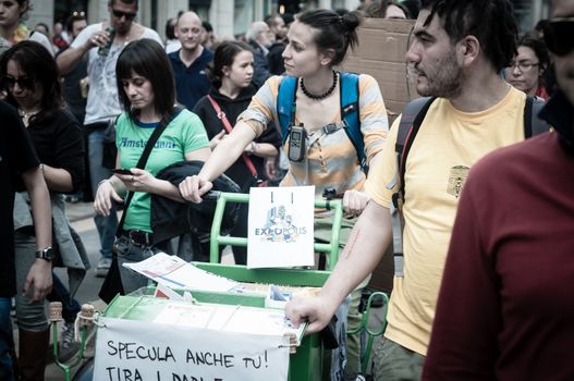 MILAN, ITALY - MAY 1: labor day held in Milan on May 1, 2013. Every year thousands of people taking to the streets to celebrate labor day and to protest against italian austerity