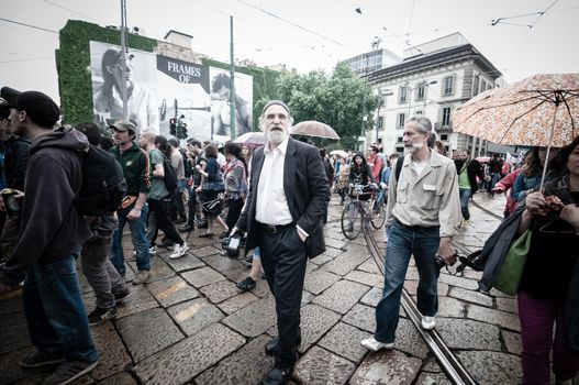 MILAN, ITALY - MAY 1: labor day held in Milan on May 1, 2013. Every year thousands of people taking to the streets to celebrate labor day and to protest against italian austerity