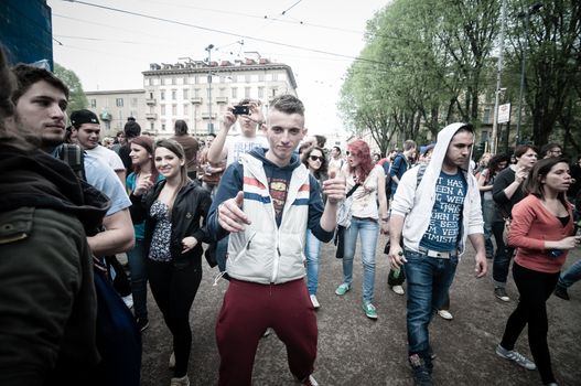 MILAN, ITALY - MAY 1: labor day held in Milan on May 1, 2013. Every year thousands of people taking to the streets to celebrate labor day and to protest against italian austerity