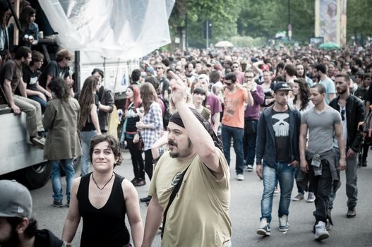 MILAN, ITALY - MAY 1: labor day held in Milan on May 1, 2013. Every year thousands of people taking to the streets to celebrate labor day and to protest against italian austerity