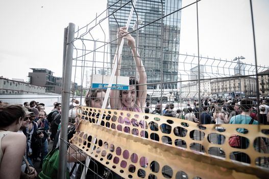 MILAN, ITALY - MAY 1: labor day held in Milan on May 1, 2013. Every year thousands of people taking to the streets to celebrate labor day and to protest against italian austerity