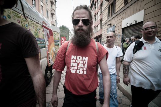 MILAN, ITALY - MAY 1: labor day held in Milan on May 1, 2013. Every year thousands of people taking to the streets to celebrate labor day and to protest against italian austerity