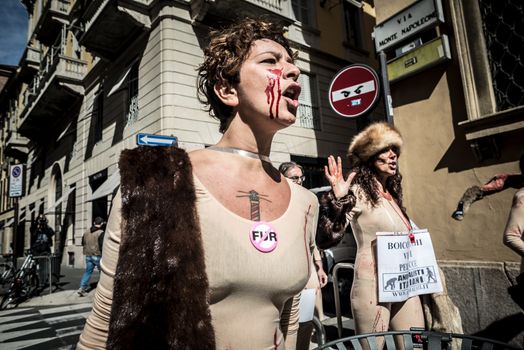 MILAN, ITALY - SEPTEMBER 17: Animalisti Italiani protest on September 17, 2013. Animal right association 'Animalisti Italiani' protest against furs and fashion, in famous fashion Milan street Monte Napoleone