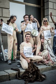 MILAN, ITALY - SEPTEMBER 17: Animalisti Italiani protest on September 17, 2013. Animal right association 'Animalisti Italiani' protest against furs and fashion, in famous fashion Milan street Monte Napoleone