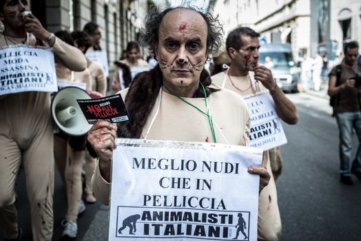 MILAN, ITALY - SEPTEMBER 17: Animalisti Italiani protest on September 17, 2013. Animal right association 'Animalisti Italiani' protest against furs and fashion, in famous fashion Milan street Monte Napoleone