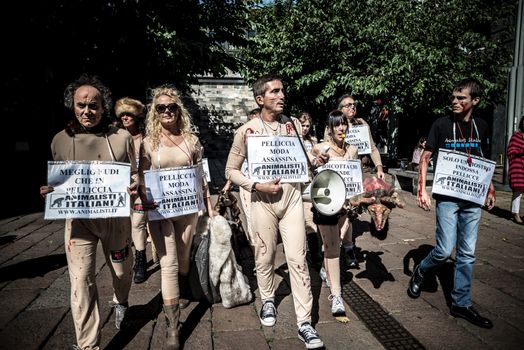 MILAN, ITALY - SEPTEMBER 17: Animalisti Italiani protest on September 17, 2013. Animal right association 'Animalisti Italiani' protest against furs and fashion, in famous fashion Milan street Monte Napoleone