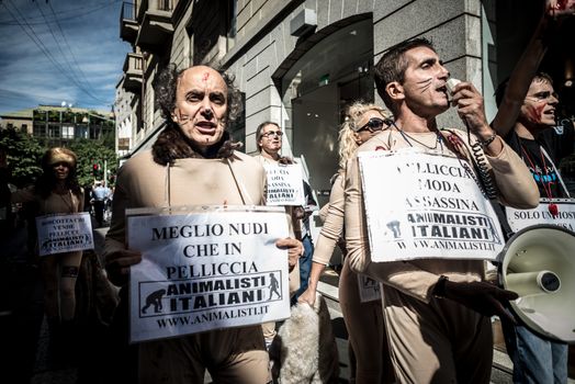 MILAN, ITALY - SEPTEMBER 17: Animalisti Italiani protest on September 17, 2013. Animal right association 'Animalisti Italiani' protest against furs and fashion, in famous fashion Milan street Monte Napoleone