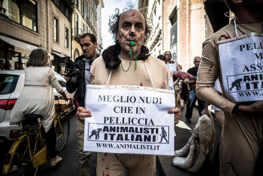 MILAN, ITALY - SEPTEMBER 17: Animalisti Italiani protest on September 17, 2013. Animal right association 'Animalisti Italiani' protest against furs and fashion, in famous fashion Milan street Monte Napoleone