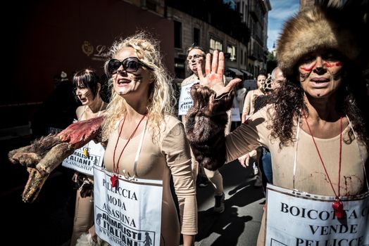 MILAN, ITALY - SEPTEMBER 17: Animalisti Italiani protest on September 17, 2013. Animal right association 'Animalisti Italiani' protest against furs and fashion, in famous fashion Milan street Monte Napoleone