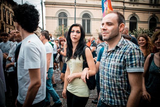 MILAN, ITALY - JUNE 29: gay pride manifestation in Milan June 29, 2013. Normal people, gay, lesbians, transgenders and bisexuals take to the street for their rights organizing a street parade party