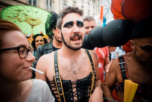 MILAN, ITALY - JUNE 29: gay pride manifestation in Milan June 29, 2013. Normal people, gay, lesbians, transgenders and bisexuals take to the street for their rights organizing a street parade party