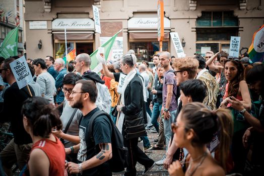 MILAN, ITALY - JUNE 29: gay pride manifestation in Milan June 29, 2013. Normal people, gay, lesbians, transgenders and bisexuals take to the street for their rights organizing a street parade party