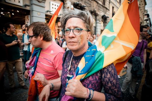 MILAN, ITALY - JUNE 29: gay pride manifestation in Milan June 29, 2013. Normal people, gay, lesbians, transgenders and bisexuals take to the street for their rights organizing a street parade party