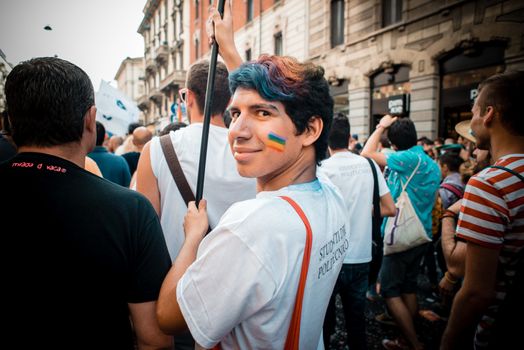 MILAN, ITALY - JUNE 29: gay pride manifestation in Milan June 29, 2013. Normal people, gay, lesbians, transgenders and bisexuals take to the street for their rights organizing a street parade party