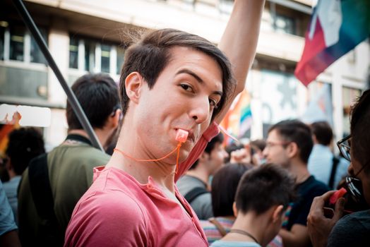 MILAN, ITALY - JUNE 29: gay pride manifestation in Milan June 29, 2013. Normal people, gay, lesbians, transgenders and bisexuals take to the street for their rights organizing a street parade party