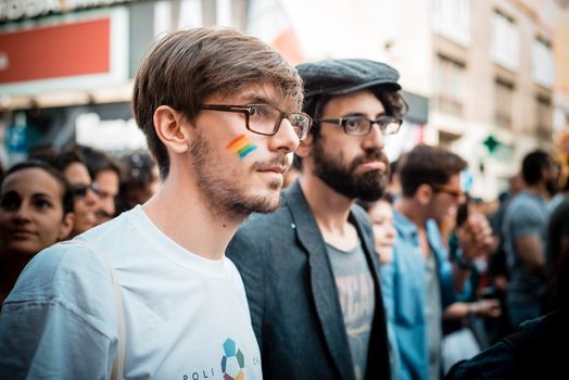 MILAN, ITALY - JUNE 29: gay pride manifestation in Milan June 29, 2013. Normal people, gay, lesbians, transgenders and bisexuals take to the street for their rights organizing a street parade party