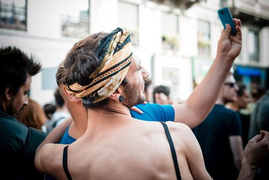 MILAN, ITALY - JUNE 29: gay pride manifestation in Milan June 29, 2013. Normal people, gay, lesbians, transgenders and bisexuals take to the street for their rights organizing a street parade party