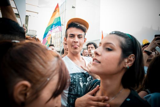 MILAN, ITALY - JUNE 29: gay pride manifestation in Milan June 29, 2013. Normal people, gay, lesbians, transgenders and bisexuals take to the street for their rights organizing a street parade party