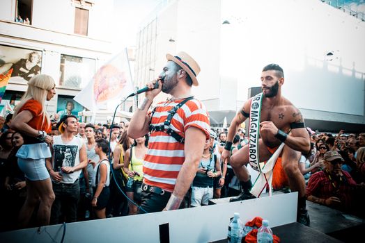 MILAN, ITALY - JUNE 29: gay pride manifestation in Milan June 29, 2013. Normal people, gay, lesbians, transgenders and bisexuals take to the street for their rights organizing a street parade party