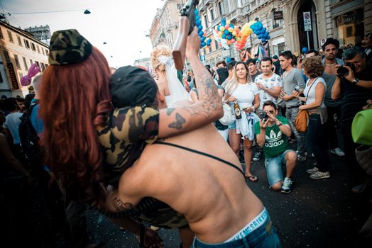 MILAN, ITALY - JUNE 29: gay pride manifestation in Milan June 29, 2013. Normal people, gay, lesbians, transgenders and bisexuals take to the street for their rights organizing a street parade party