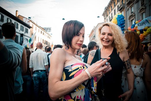 MILAN, ITALY - JUNE 29: gay pride manifestation in Milan June 29, 2013. Normal people, gay, lesbians, transgenders and bisexuals take to the street for their rights organizing a street parade party