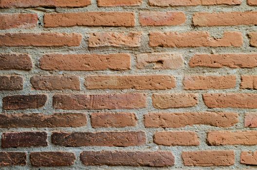 Aged street brick wall background, texture 