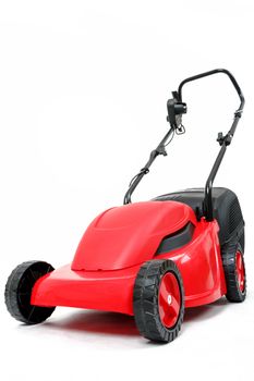 new red lawnmower isolated on white, studio shoot