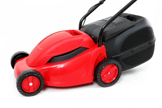 new red lawnmower isolated on white, studio shoot