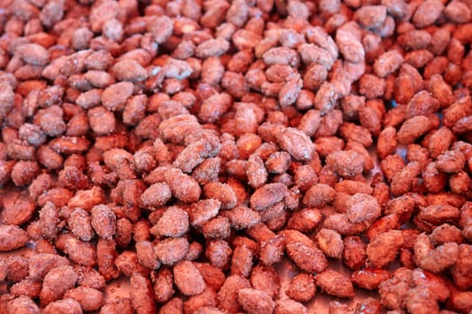 Heap of sweet roasted almonds  glazed with sugar in a market