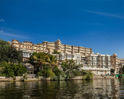 India luxury tourism concept background - Udaipur City Palace from Lake Pichola. Udaipur, Rajasthan, India