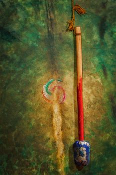 Beater and large tibetan drum in Hemis gompa (Tibetan Buddhist monastery). Ladakh, India