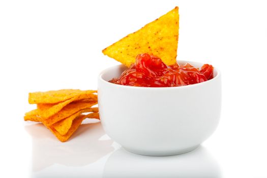 Nachos corn chips with fresh salsa isolated on white