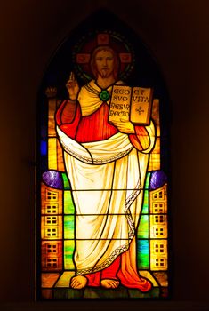 Stained glass depicting Jesus Christ in the church.