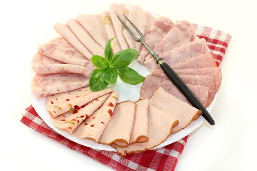 different types of sausage on a white plate