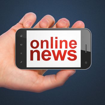 News concept: hand holding smartphone with word Online News on display. Generic mobile smart phone in hand on Dark Blue background.