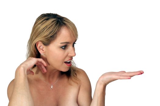 A lovely blonde with bare shoulders, holding her hand out to her side, palm up, with an excited or surprised facial expression.  Isolated on a white background.