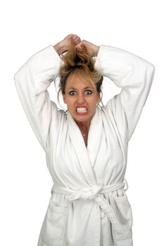 A lovely but insane, angry, or frustrated blonde, pulling her hair.  Isolated on a white background.