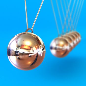 A Colourful 3d Rendered Newtons Cradle Illustration against a Blue Background