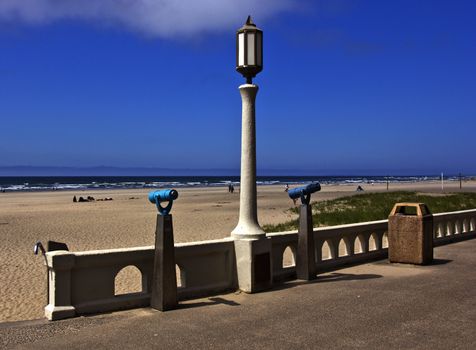 Monoculars and a light post overlooking the beach in Seasise OR.