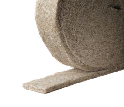 A Roll of insulation material made of flax / linen. This kind of narrow flax material can be used as insulation between logs in a log cabin.