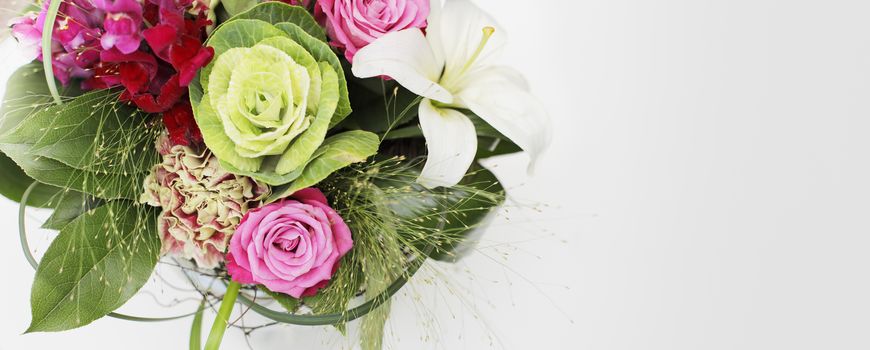 Professionally arranged flower bouquet. Roses, lily and others. Panoramic image with copy space on the right side.