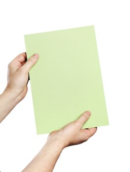 Man holding a light green paper in his hands.