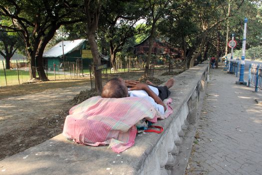 Homeless people sleeping on the footpath of Kolkata. on November 25, 2012 in Kolkata, India.