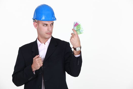 foreman with bank notes in hand