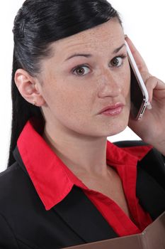 smart brunette on the phone